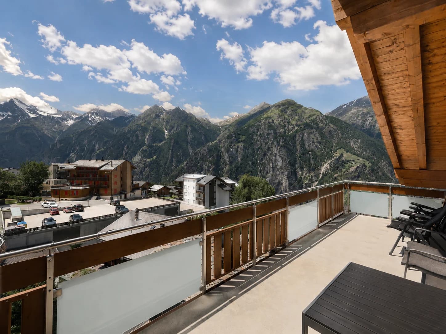 Balcony view over Grächen and the Swiss Alps